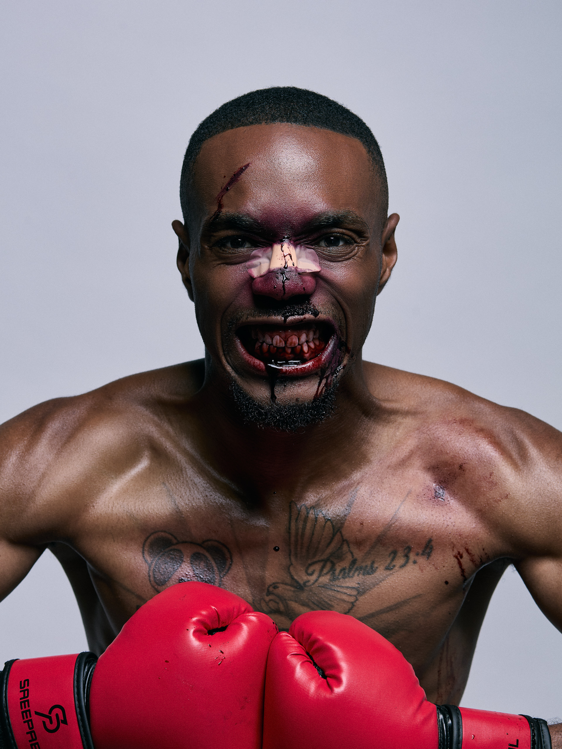 Final composited boxing portrait by Illvsions Photography, ringside background